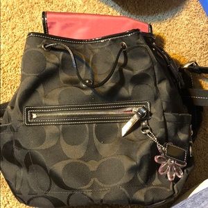Coach black backpack with side pockets